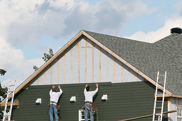 Professional Siding Contractor technician working in Brunswick, NC